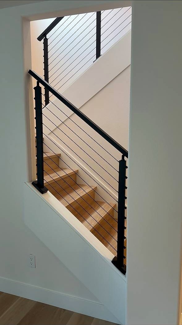 Cable railing framing a stairwell opening