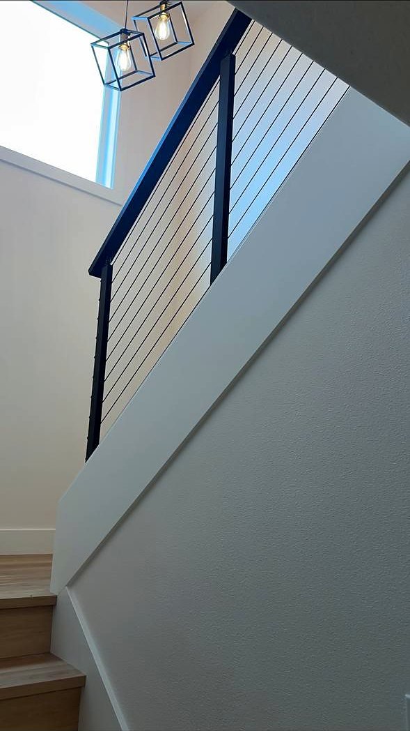 Cable railing viewed from the bottom of the stairs
