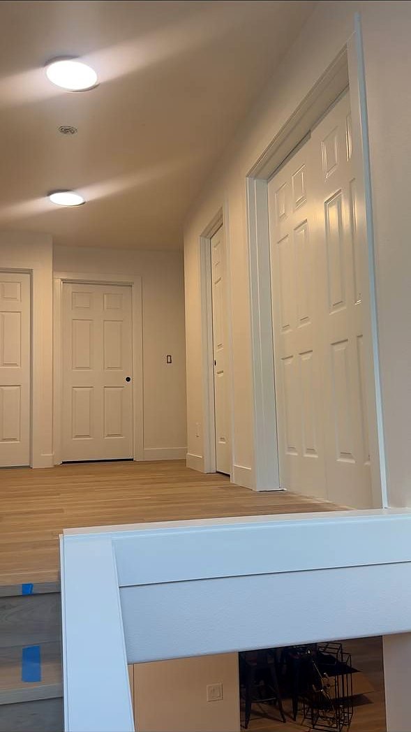 Interior doors and trim along a hallway